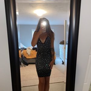 Black sequin midi dress.